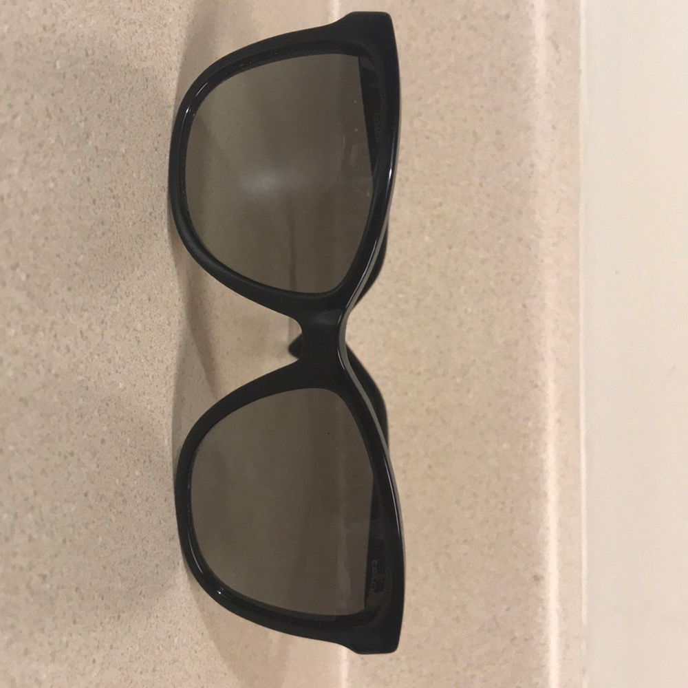 Woman’s Black Coach sunglasses